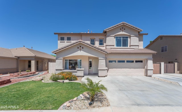 view of front of property featuring a tile roof, an attached garage, driveway, and stucco siding