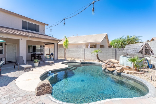view of pool featuring a fenced in pool, a patio, and a fenced backyard
