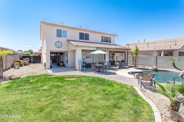 rear view of house featuring a fenced backyard, stucco siding, a lawn, a patio area, and a fenced in pool