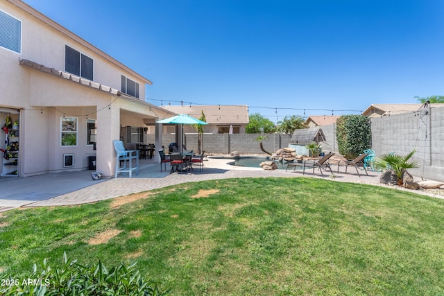 view of yard with a fenced backyard and a patio