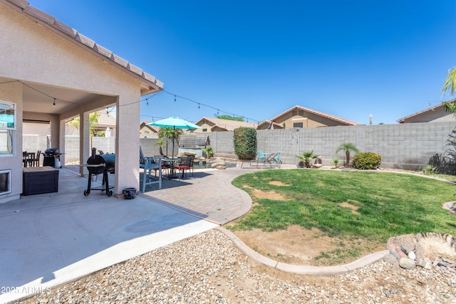 view of yard featuring a fenced backyard and a patio