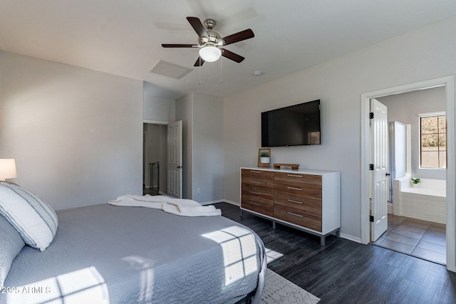 bedroom featuring dark hardwood / wood-style flooring, connected bathroom, and ceiling fan