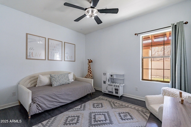 bedroom featuring ceiling fan and dark hardwood / wood-style floors