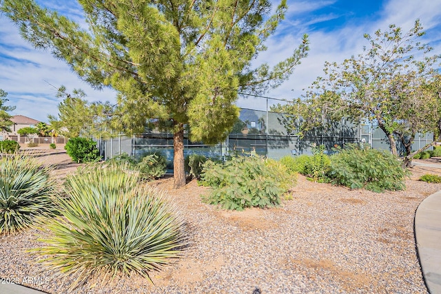 view of yard featuring tennis court