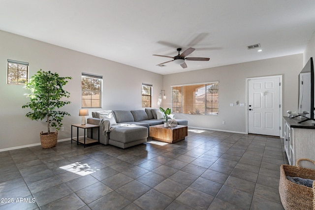 tiled living room featuring ceiling fan