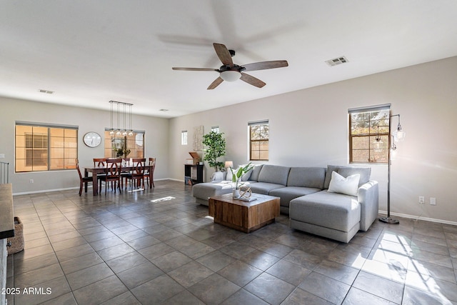 tiled living room featuring ceiling fan