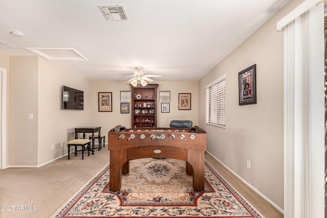 playroom featuring ceiling fan and light colored carpet