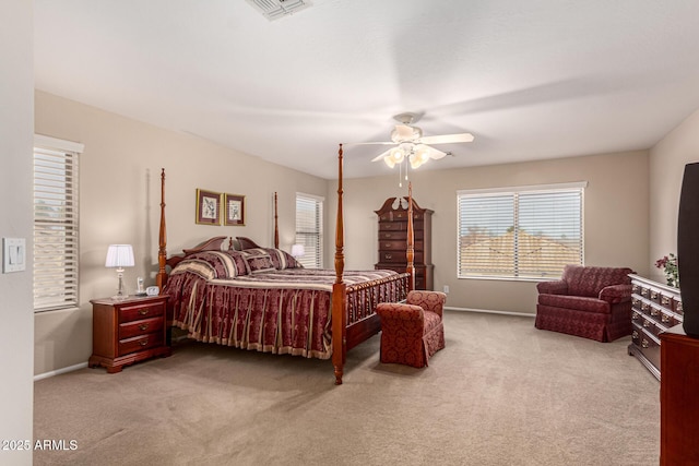 bedroom with ceiling fan and light carpet