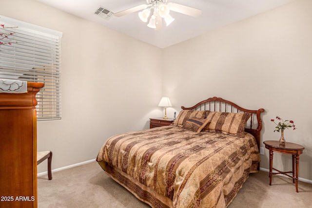 bedroom featuring light carpet and ceiling fan