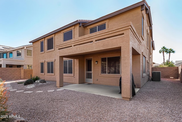 view of front of house featuring central AC and a patio area