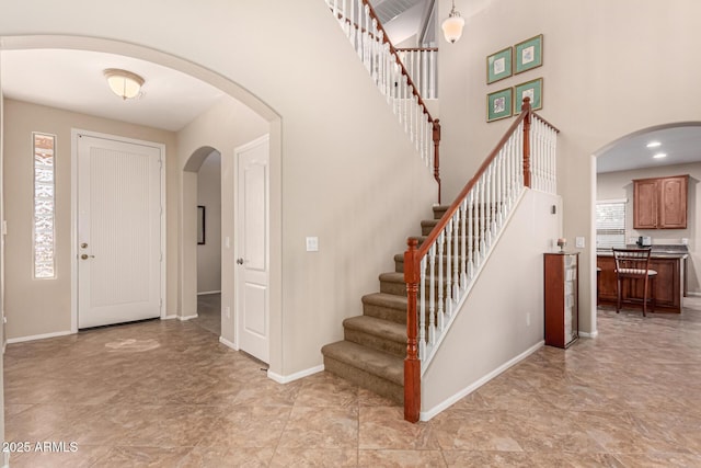 entryway with a high ceiling