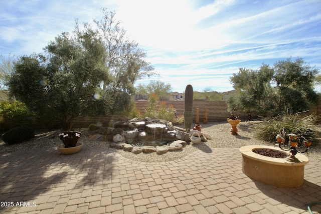 view of patio with a fire pit