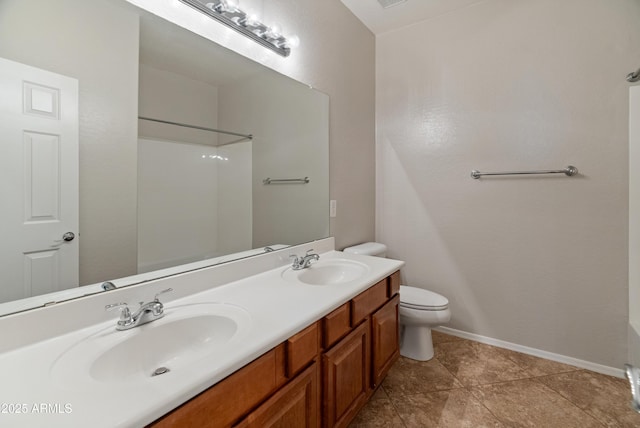bathroom with a shower, toilet, double vanity, and a sink
