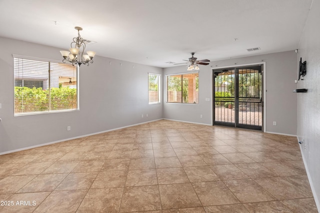 empty room with light tile patterned flooring, visible vents, baseboards, and ceiling fan with notable chandelier