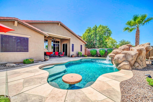 3214 N 138th Dr, Avondale, AZ 85392 - view of swimming pool with ceiling fan, a patio, a fenced backyard, and outdoor lounge area