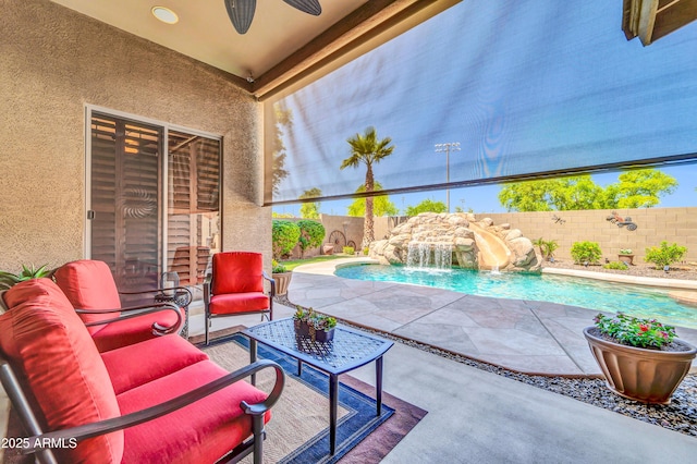 3214 N 138th Dr, Avondale, AZ 85392 - fenced backyard featuring a patio area, a ceiling fan, and an outdoor hangout area