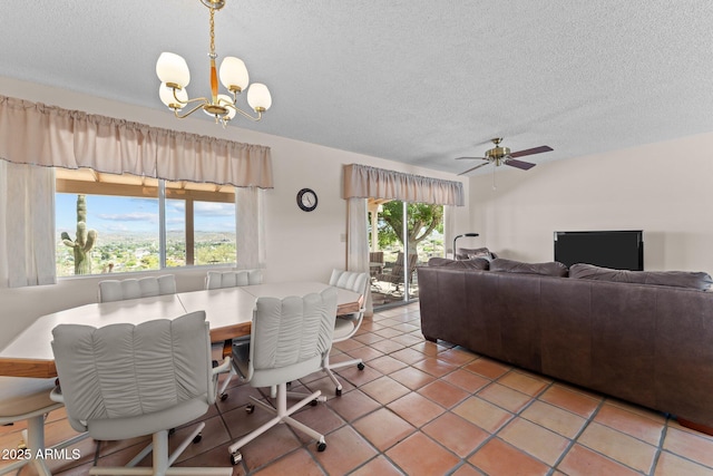 637 Chaparral Rd, Wickenburg, AZ 85390 - dining area with light tile patterned floors, ceiling fan with notable chandelier, and a textured ceiling
