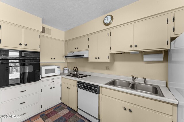 637 Chaparral Rd, Wickenburg, AZ 85390 - kitchen featuring a sink, white appliances, light countertops, under cabinet range hood, and visible vents