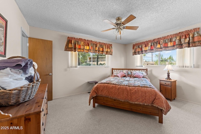 637 Chaparral Rd, Wickenburg, AZ 85390 - carpeted bedroom with baseboards, a textured ceiling, and ceiling fan