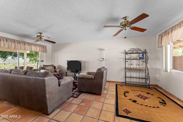 637 Chaparral Rd, Wickenburg, AZ 85390 - living area with light tile patterned floors, a ceiling fan, and a textured ceiling