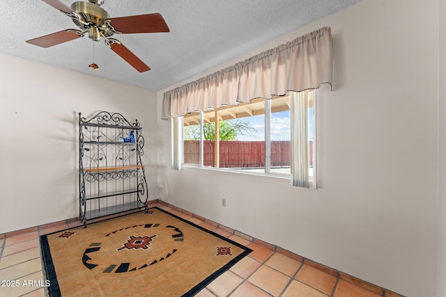 637 Chaparral Rd, Wickenburg, AZ 85390 - tiled empty room with a textured ceiling and ceiling fan