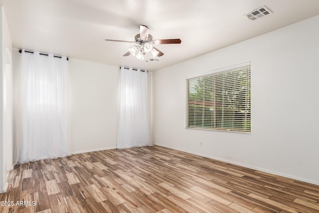 unfurnished room with ceiling fan and light hardwood / wood-style flooring