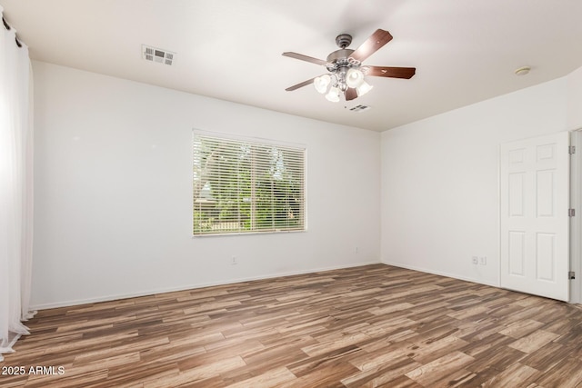 unfurnished room featuring ceiling fan and wood-type flooring