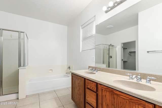 bathroom with tile patterned flooring, vanity, and plus walk in shower