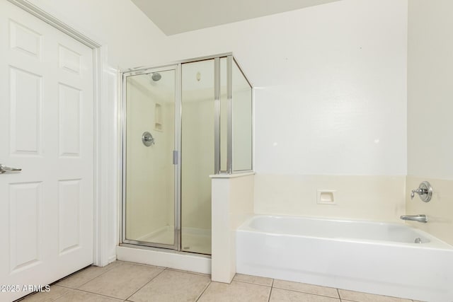 bathroom with plus walk in shower and tile patterned flooring