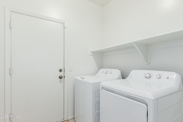 laundry room featuring washer and clothes dryer