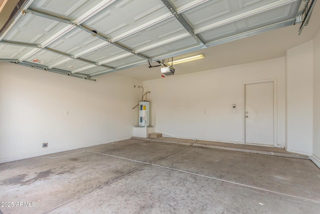 garage featuring a garage door opener and electric water heater