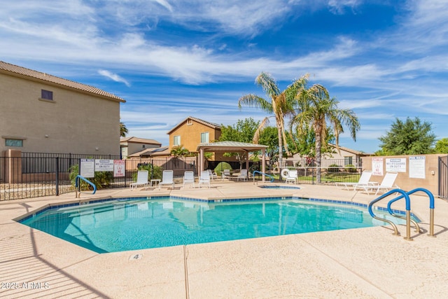 view of swimming pool with a community hot tub, a gazebo, and a patio area