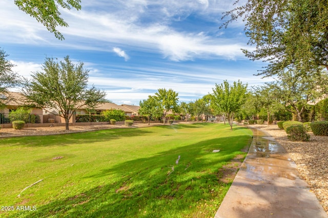 view of property's community with a lawn