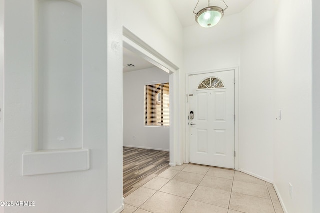 foyer featuring light tile patterned floors