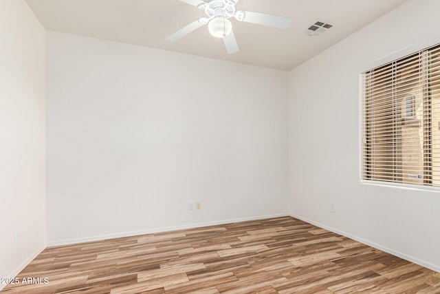 unfurnished room with ceiling fan and light wood-type flooring