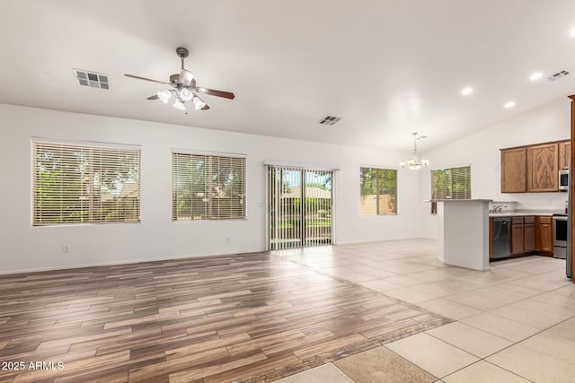 kitchen with lofted ceiling, sink, decorative light fixtures, dishwasher, and ceiling fan with notable chandelier