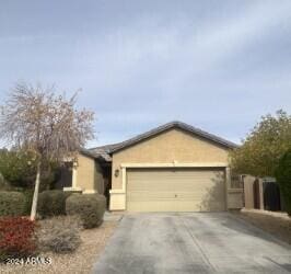 ranch-style home featuring a garage