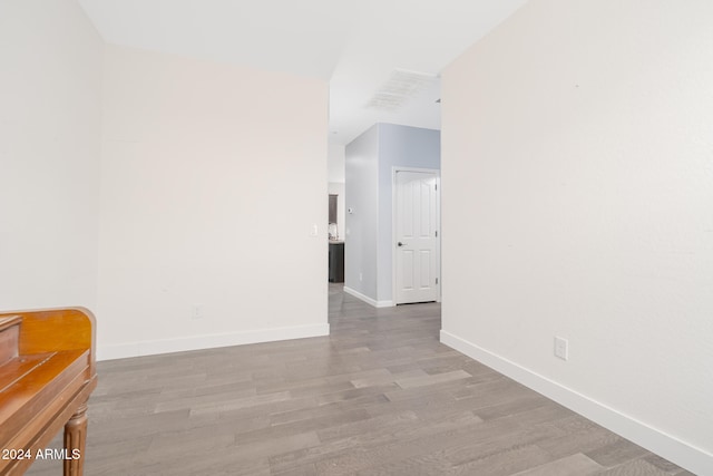 spare room with hardwood / wood-style floors