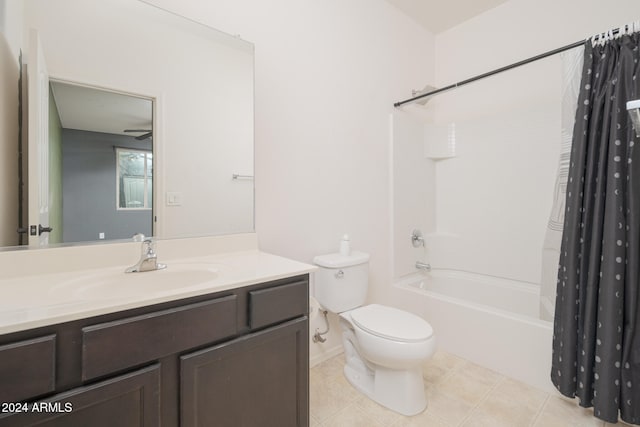 full bathroom featuring vanity, shower / tub combo with curtain, ceiling fan, tile patterned flooring, and toilet