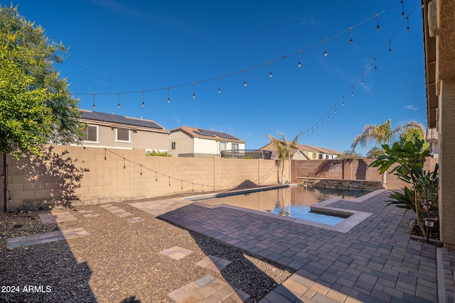 view of patio featuring a fenced in pool