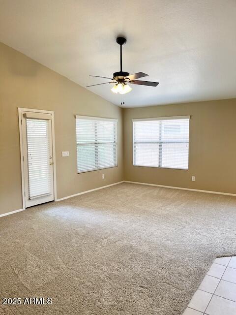 6376 W Adobe Dr, Glendale, AZ 85308 - empty room with ceiling fan, light colored carpet, baseboards, and vaulted ceiling