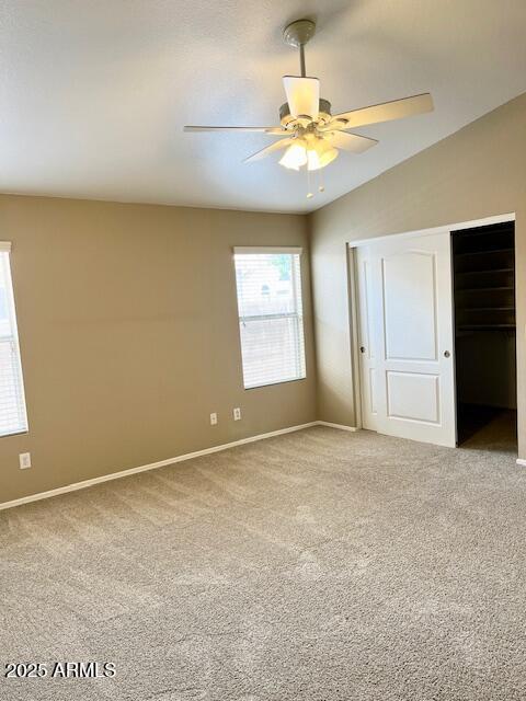 6376 W Adobe Dr, Glendale, AZ 85308 - unfurnished bedroom with light colored carpet, baseboards, a closet, and ceiling fan