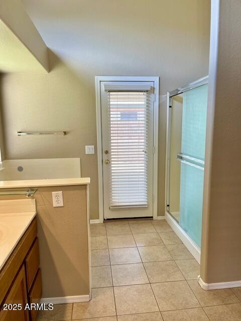 6376 W Adobe Dr, Glendale, AZ 85308 - bathroom with vanity, tile patterned flooring, baseboards, and a shower with door