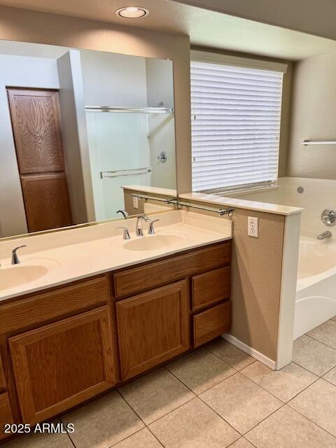 6376 W Adobe Dr, Glendale, AZ 85308 - full bath featuring tile patterned flooring, double vanity, a garden tub, and a shower stall