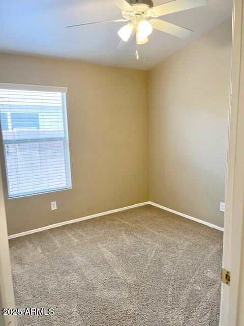6376 W Adobe Dr, Glendale, AZ 85308 - spare room with carpet floors, baseboards, and ceiling fan