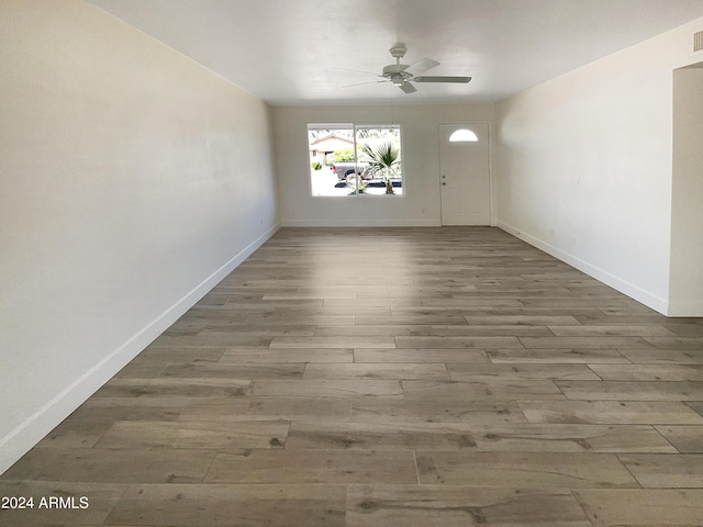 unfurnished room featuring ceiling fan and hardwood / wood-style floors