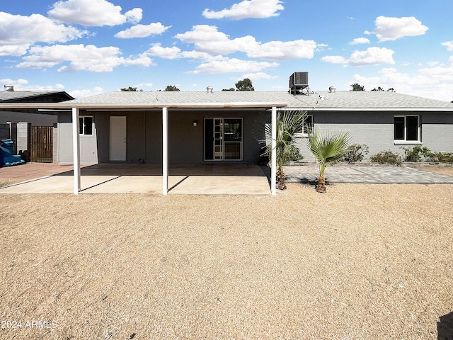 back of house featuring a patio area and central air condition unit