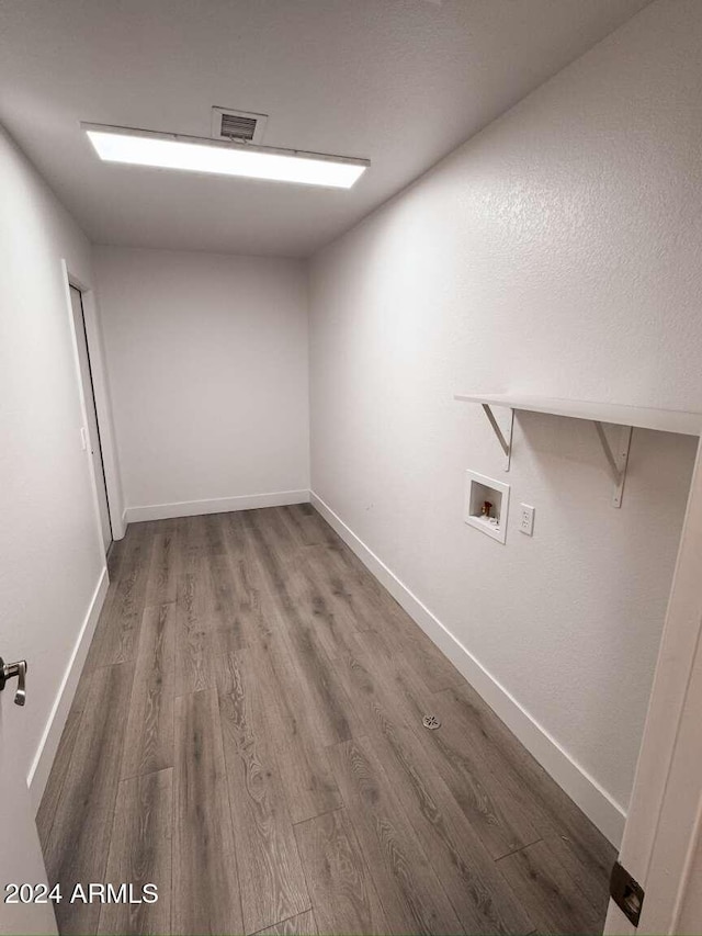 laundry room with hookup for a washing machine and hardwood / wood-style floors