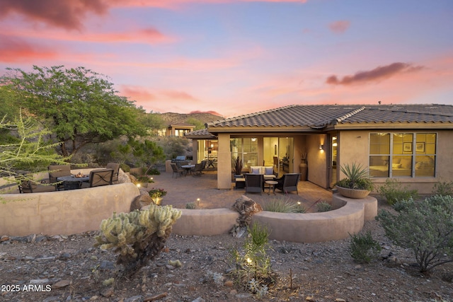 11400 E Helm Dr, Scottsdale, AZ 85255 - back of property featuring an outdoor living space, a patio area, stucco siding, and a tile roof
