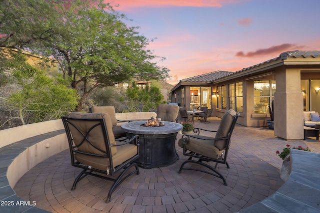 11400 E Helm Dr, Scottsdale, AZ 85255 - patio terrace at dusk with an outdoor fire pit